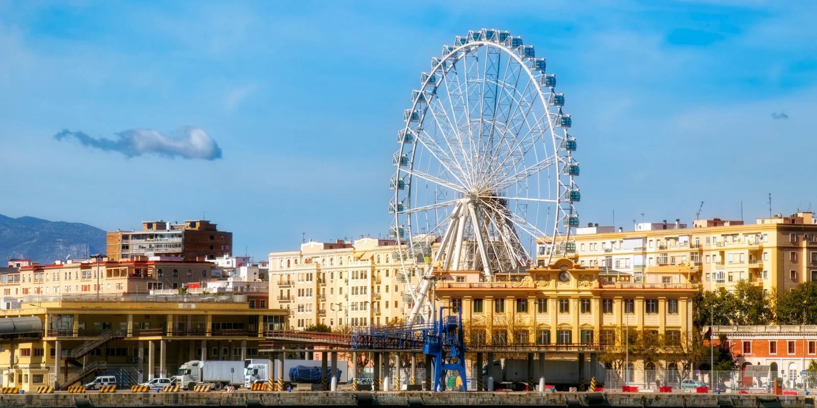 Málaga seafront under clear spring light with the harbour in the background